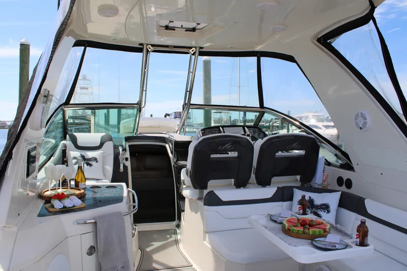 Slide: The Image of Luxurious 2013 Monterey 340 Sport Yacht interior with elegant seating and refreshments. - 47