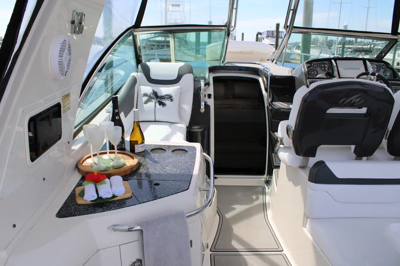 Slide: The Image of 2013 Monterey 340 Sport Yacht interior with luxury seating and refreshments. - 50