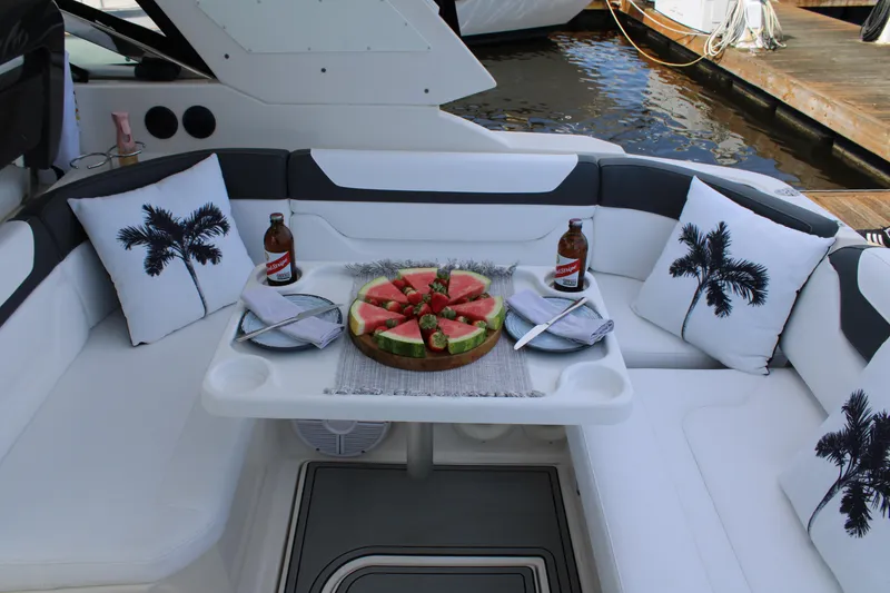 Slide: The Image of 2013 Monterey 340 Sport Yacht interior with watermelon platter and palm tree pillows. - 54