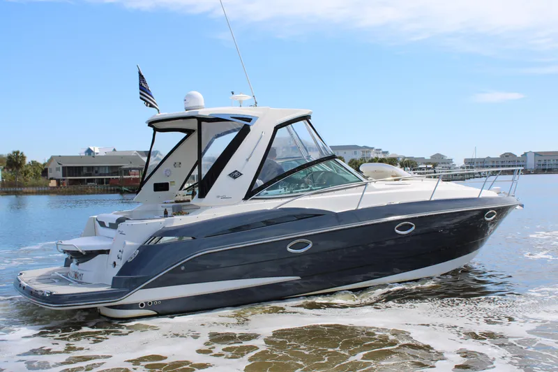 Slide: The Image of 2013 Monterey 340 Sport Yacht cruising on calm waters, showcasing sleek design and modern features. - 7