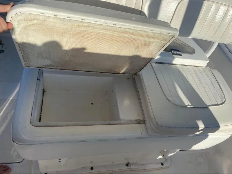 Slide: The Image of Open storage compartment on 2014 Sea Fox 256 Commander boat seat. - 14