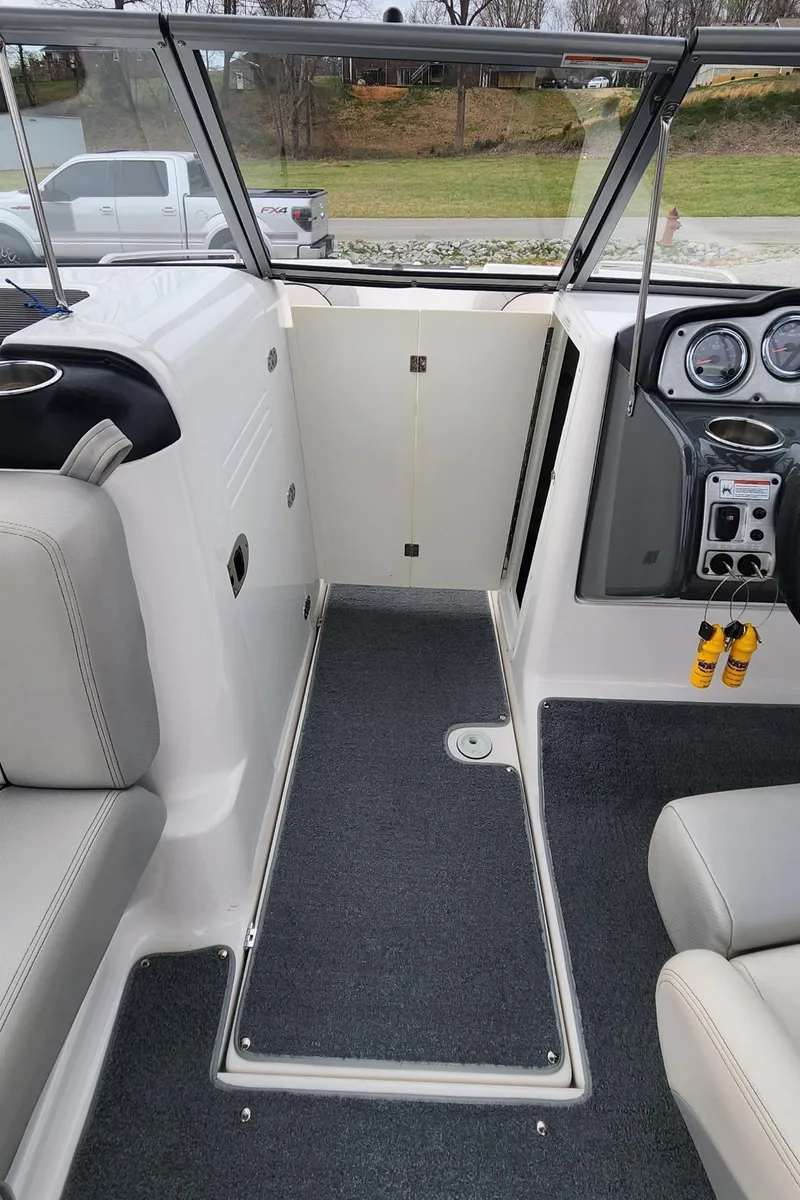Slide: The Image of 2011 Yamaha Boats AR240 High Output interior with seating and dashboard controls. - 10