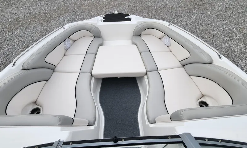Slide: The Image of 2011 Yamaha AR240 High Output boat interior with cushioned seating and sleek design. - 11