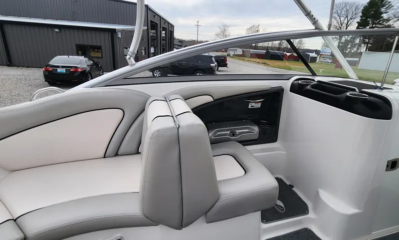 Slide: The Image of 2011 Yamaha Boats AR240 High Output interior with gray and white seating. - 8