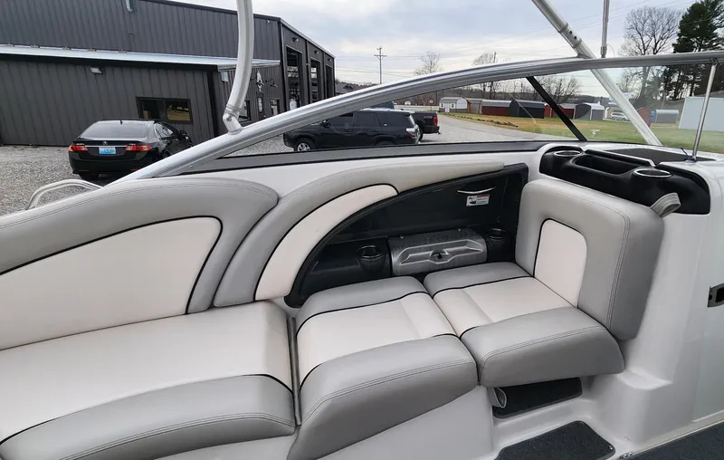 Slide: The Image of 2011 Yamaha AR240 High Output boat interior with gray and white seating. - 9