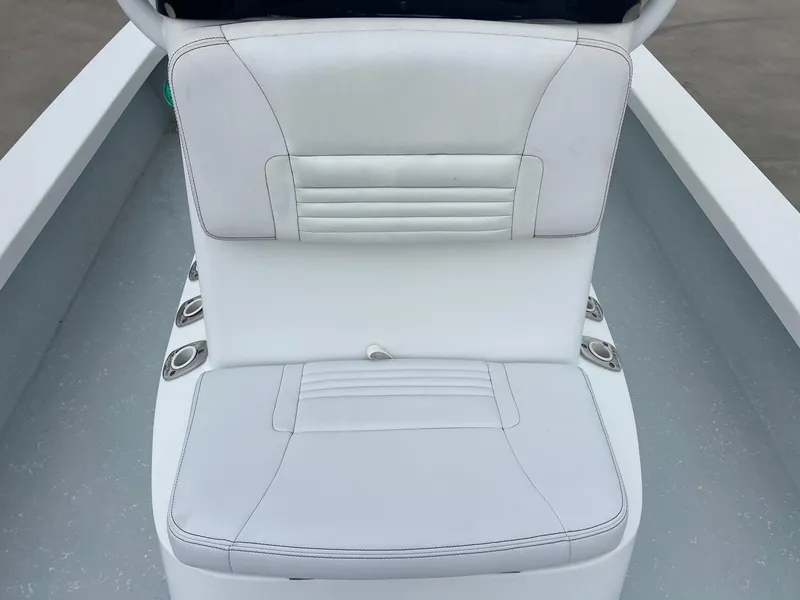 Slide: The Image of White cushioned seat on 2018 Blazer 2420 GTS boat, featuring cup holders. - 20