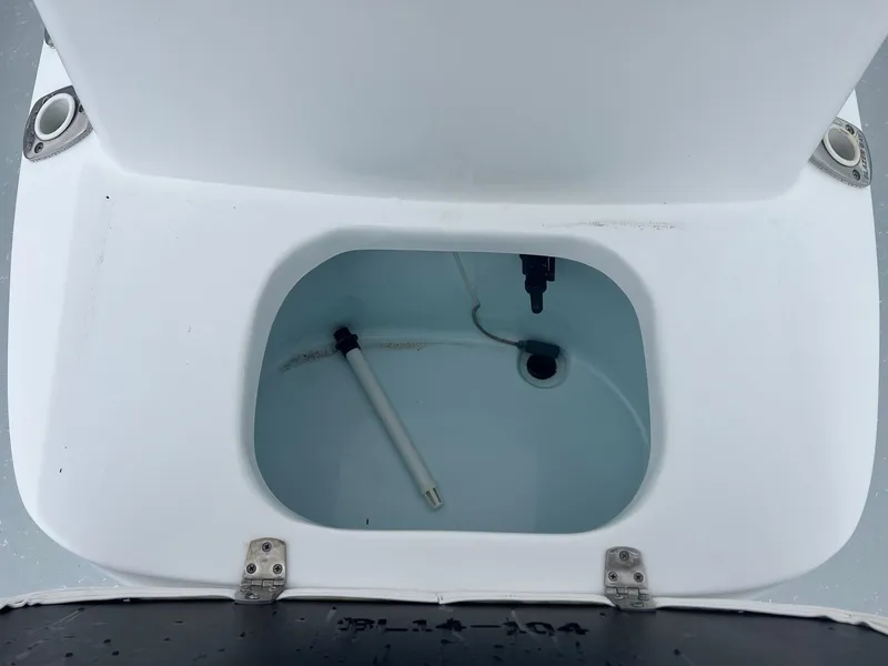 Slide: The Image of Open storage compartment in 2018 Blazer 2420 GTS boat, featuring a clean interior. - 21