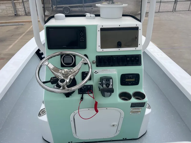 Slide: The Image of 2018 Blazer 2420 GTS boat console with steering wheel and control panel. - 23