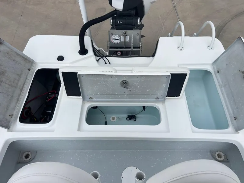 Slide: The Image of 2018 Blazer 2420 GTS boat deck with open storage compartments and seating. - 26