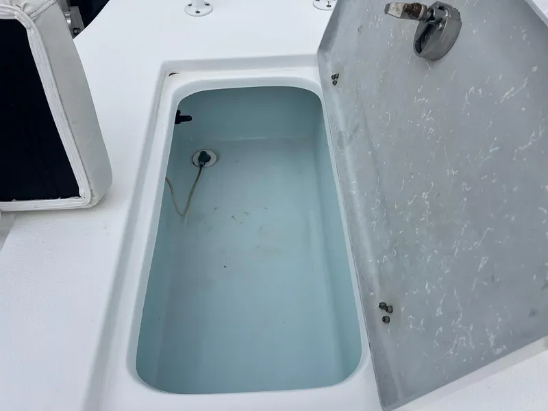 Slide: The Image of Open storage compartment on 2018 Blazer 2420 GTS boat deck. - 27