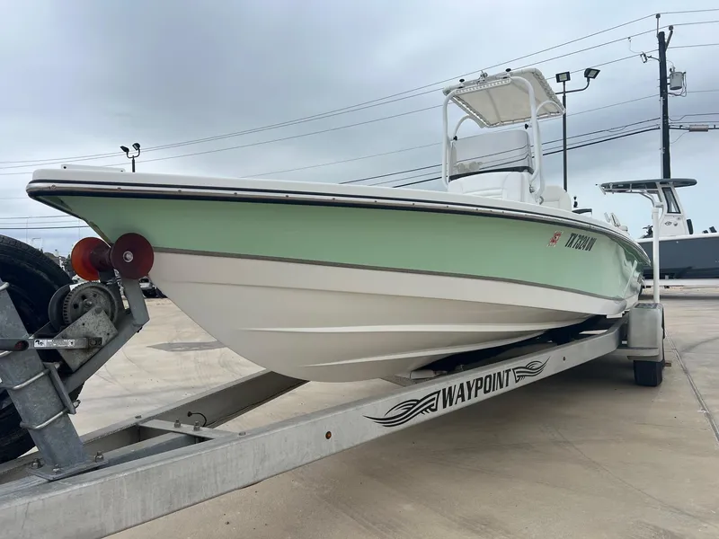 Slide: The Image of 2018 Blazer 2420 GTS boat on trailer, light green hull, overcast sky. - 5