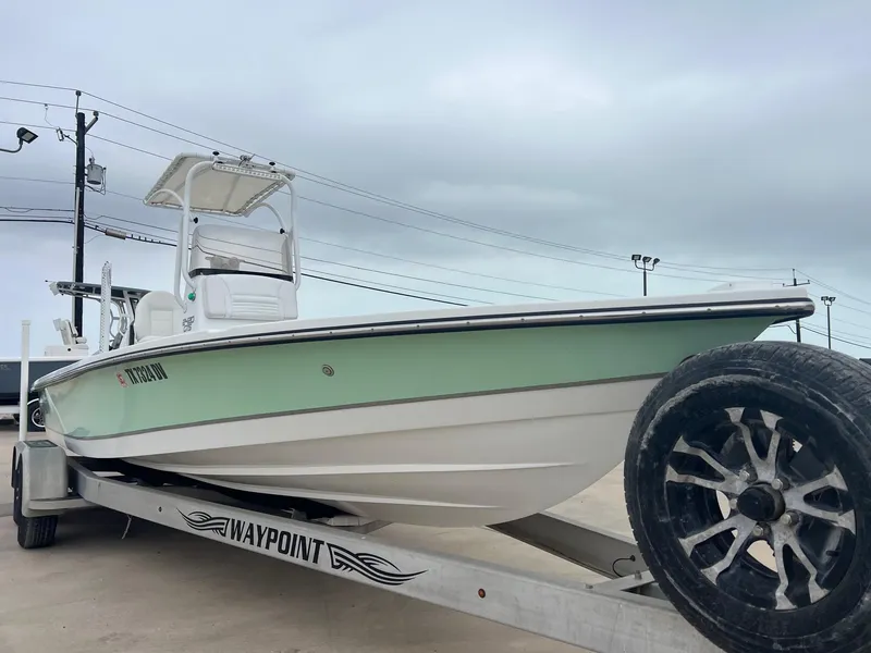 Slide: The Image of 2018 Blazer 2420 GTS boat on trailer, overcast sky background. - 8