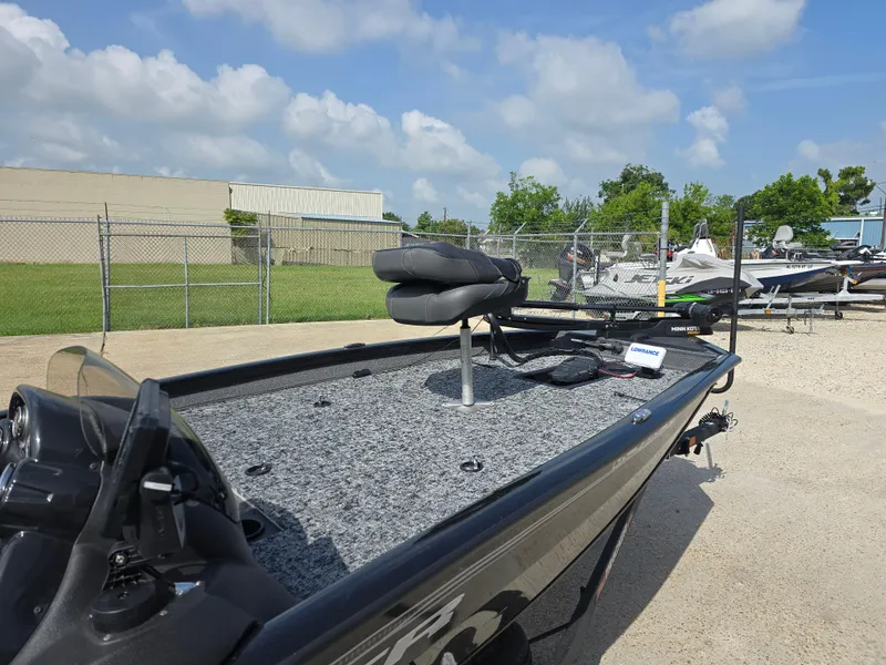 Slide: The Image of 2024 Bass Tracker PRO TEAM 190 boat with fishing seat and equipment on deck. - 6