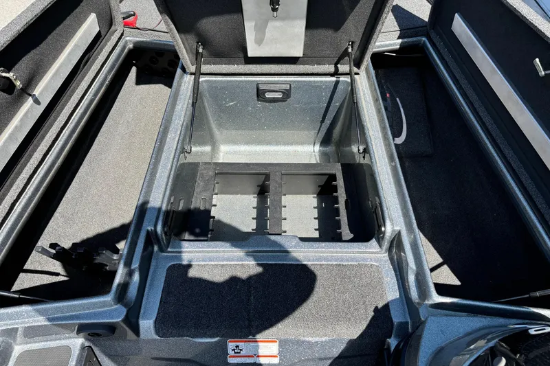Slide: The Image of 2014 Nitro Z-8 boat storage compartment with open lid, showcasing spacious interior. - 5