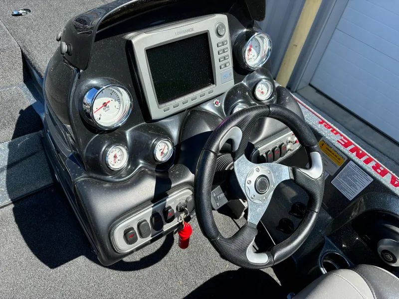 Slide: The Image of Dashboard of a 2014 Nitro Z-8 boat with steering wheel and gauges. - 7
