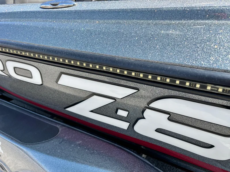 Slide: The Image of Close-up of 2014 Nitro Z-8 boat model with sleek design and LED lights. - 9