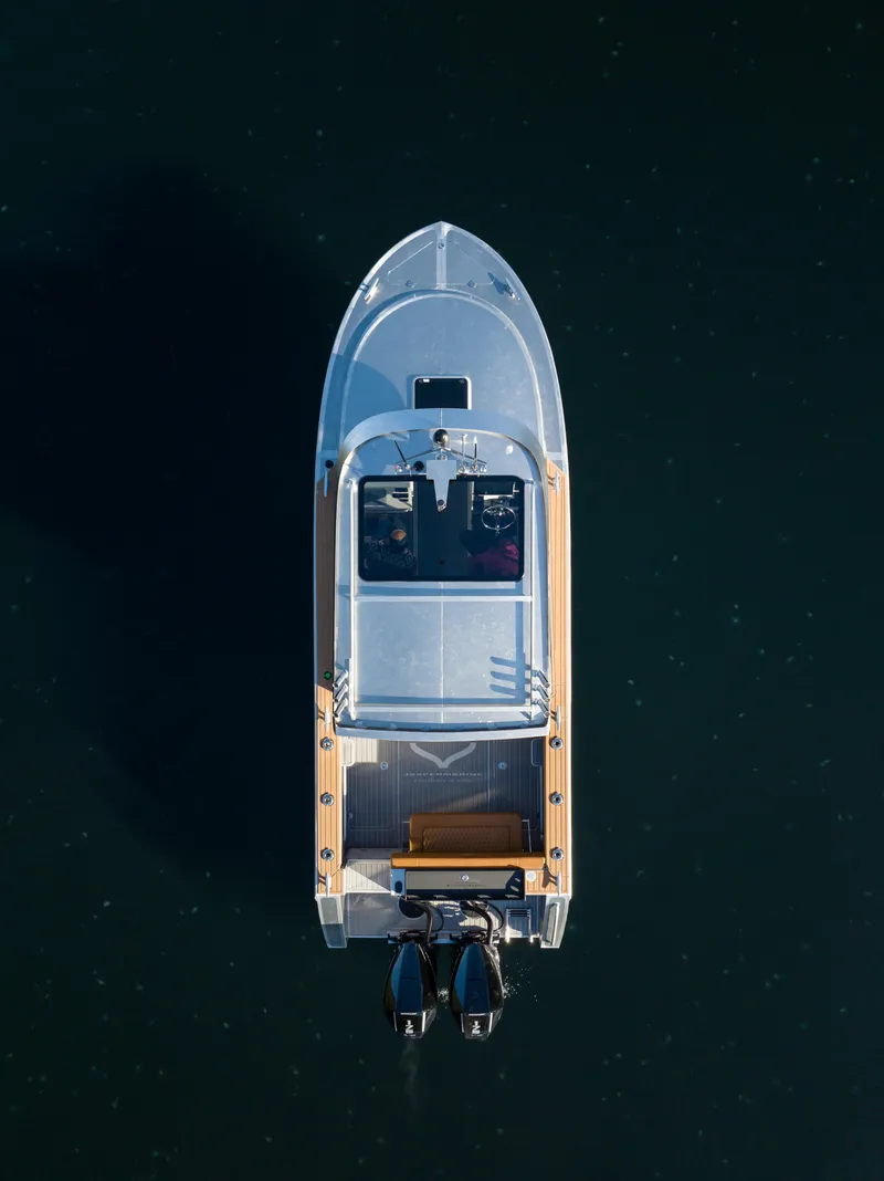 Slide: The Image of Aerial view of 2025 Jasper Marine Defender 22 - Storm Bow boat on water. - 1