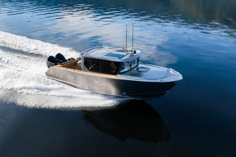 Slide: The Image of 2025 Jasper Marine Defender 22 - Storm Bow cruising on calm water. - 0