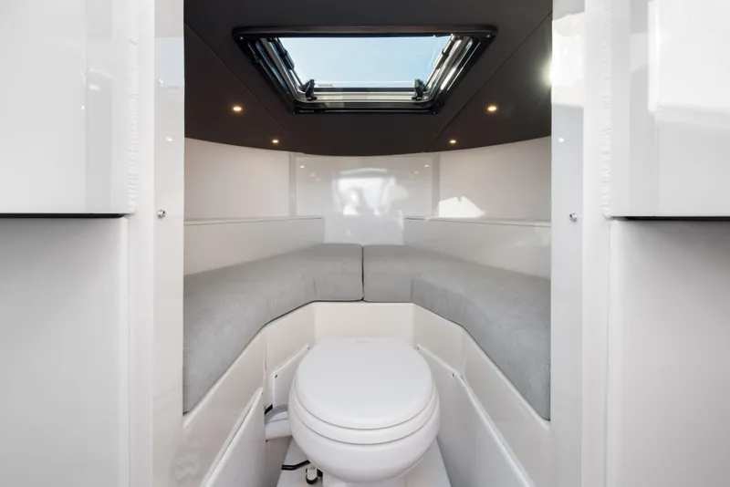 Slide: The Image of 2025 Jasper Marine Defender 22 cabin interior with skylight and seating. - 5