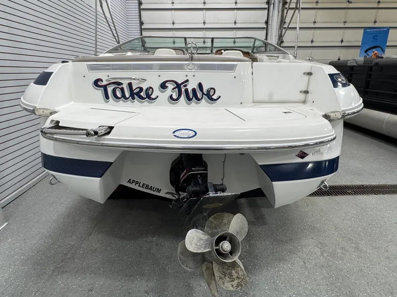 Slide: The Image of 2001 Cobalt 246 boat named "Take Five" in a garage setting. - 3