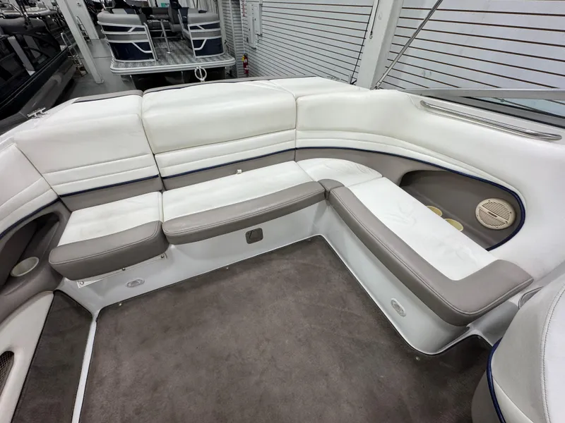 Slide: The Image of 2001 Cobalt 246 boat interior with white and gray seating, spacious and well-maintained. - 7