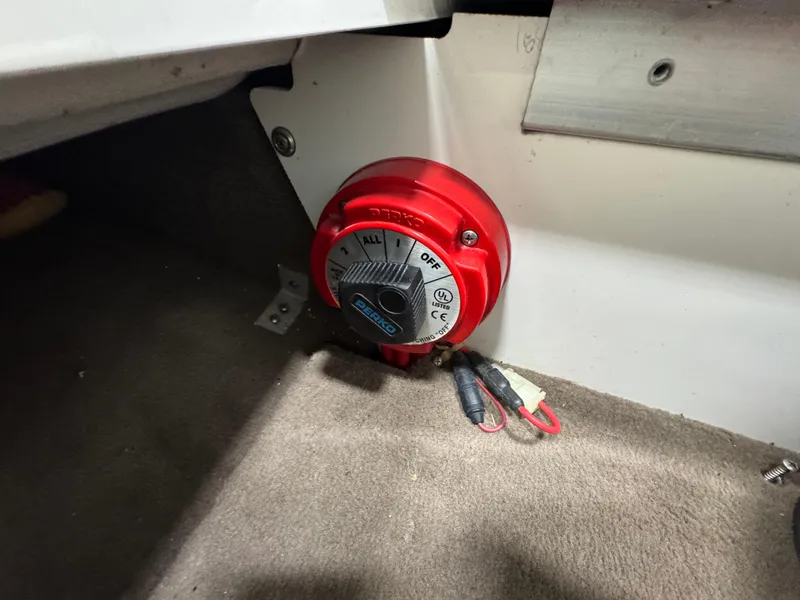 Slide: The Image of Red battery switch in a 2001 Cobalt 246 boat interior. - 9