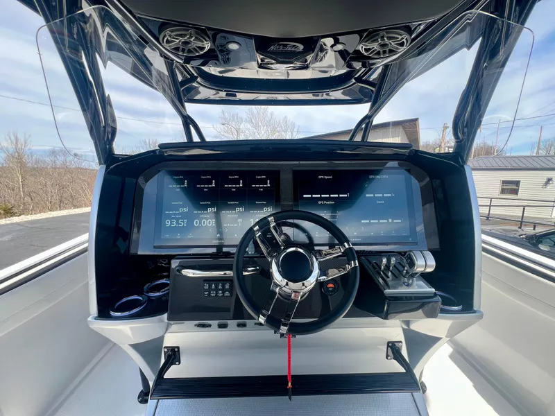 Slide: The Image of 2025 Nor-Tech 390 Sport Center Console dashboard with advanced navigation and control systems. - 27
