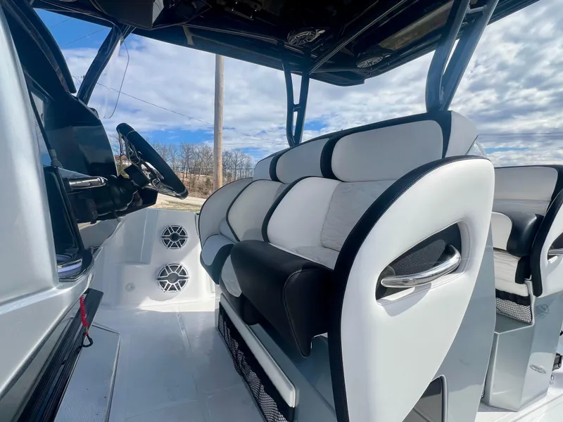 Slide: The Image of 2025 Nor-Tech 390 Sport Center Console interior with sleek seating and modern steering. - 38