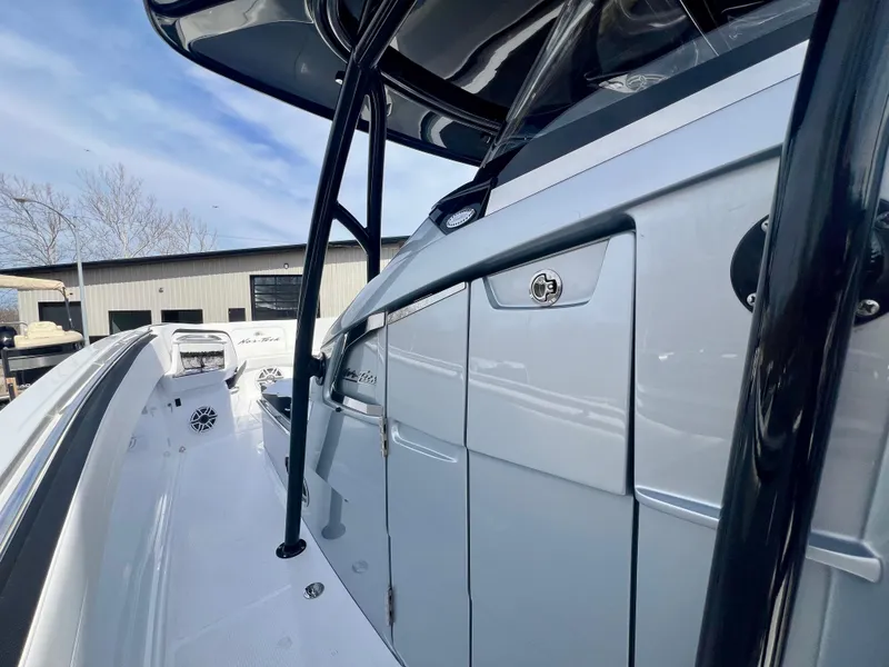 Slide: The Image of 2025 Nor-Tech 390 Sport Center Console, sleek design, modern features, outdoor view. - 39