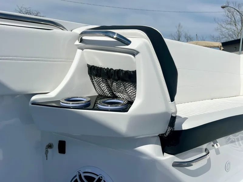 Slide: The Image of 2025 Nor-Tech 390 Sport Center Console boat interior with cup holders and seating. - 44