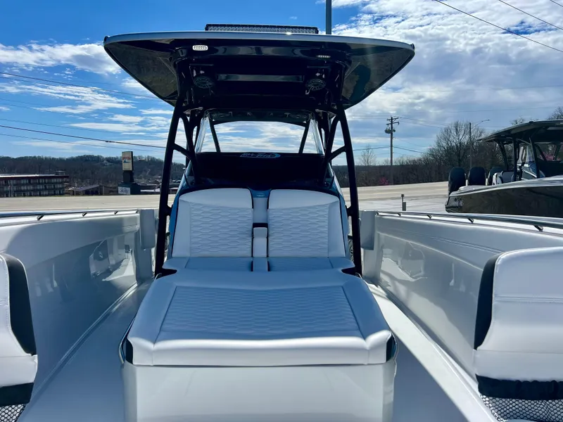 Slide: The Image of 2025 Nor-Tech 390 Sport Center Console boat with sleek seating and modern design. - 49