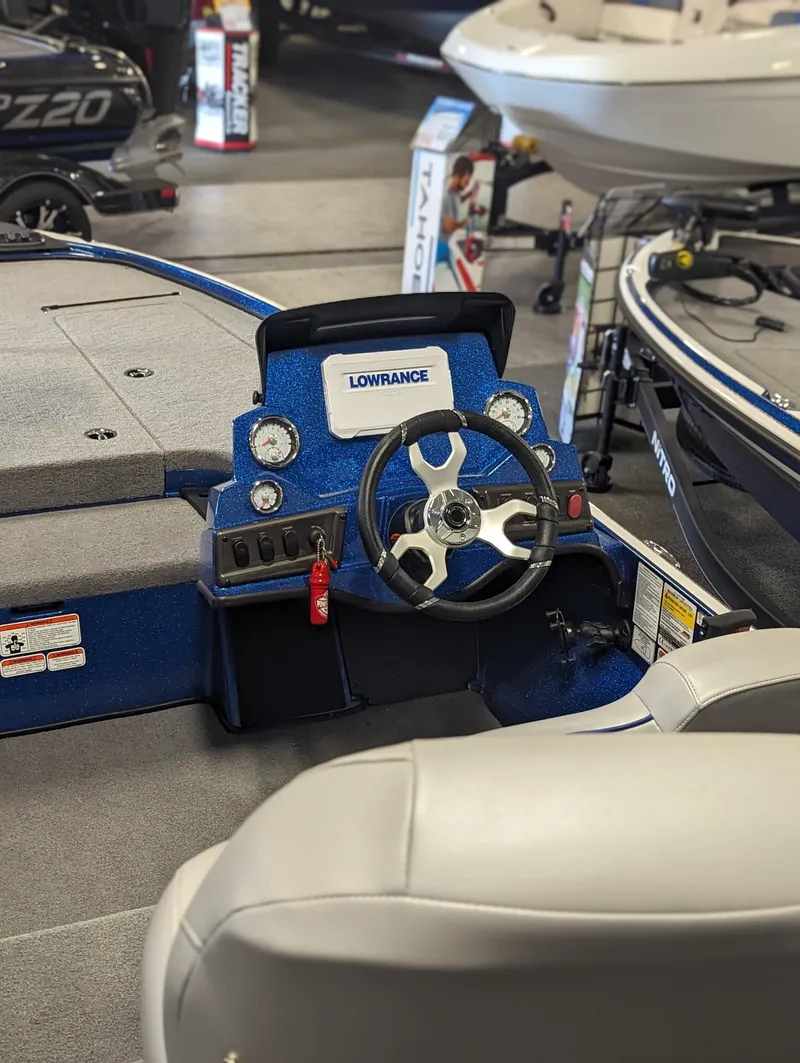Slide: The Image of 2024 Nitro Z18Pro boat dashboard with steering wheel and control panel. - 13
