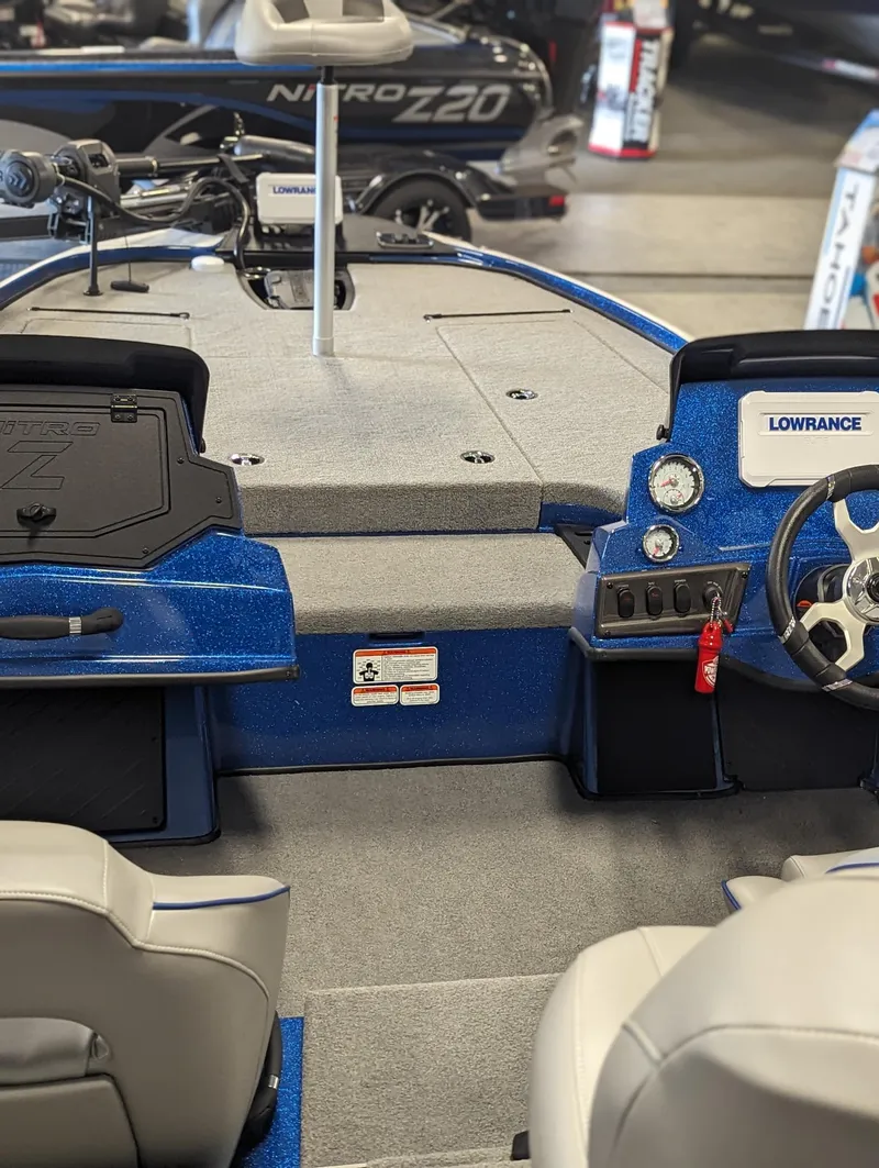 Slide: The Image of 2024 Nitro Z18Pro boat interior with steering wheel and control panel. - 14