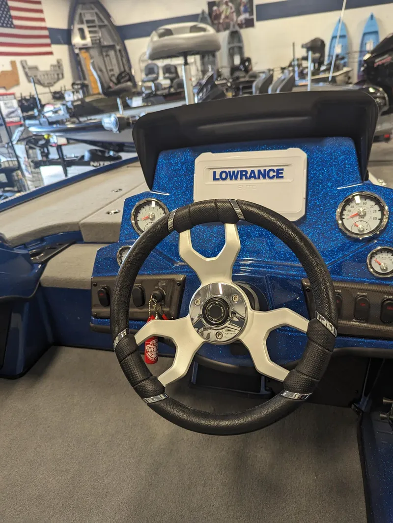 Slide: The Image of Steering wheel and dashboard of 2024 Nitro Z18Pro boat with Lowrance electronics. - 17