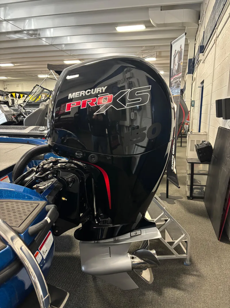 Slide: The Image of 2024 Nitro Z18Pro with Mercury Pro XS outboard motor in showroom. - 2