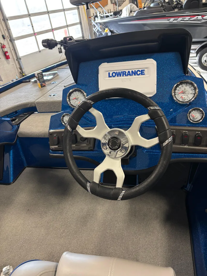 Slide: The Image of 2024 Nitro Z18Pro boat dashboard with Lowrance system and modern steering wheel. - 7