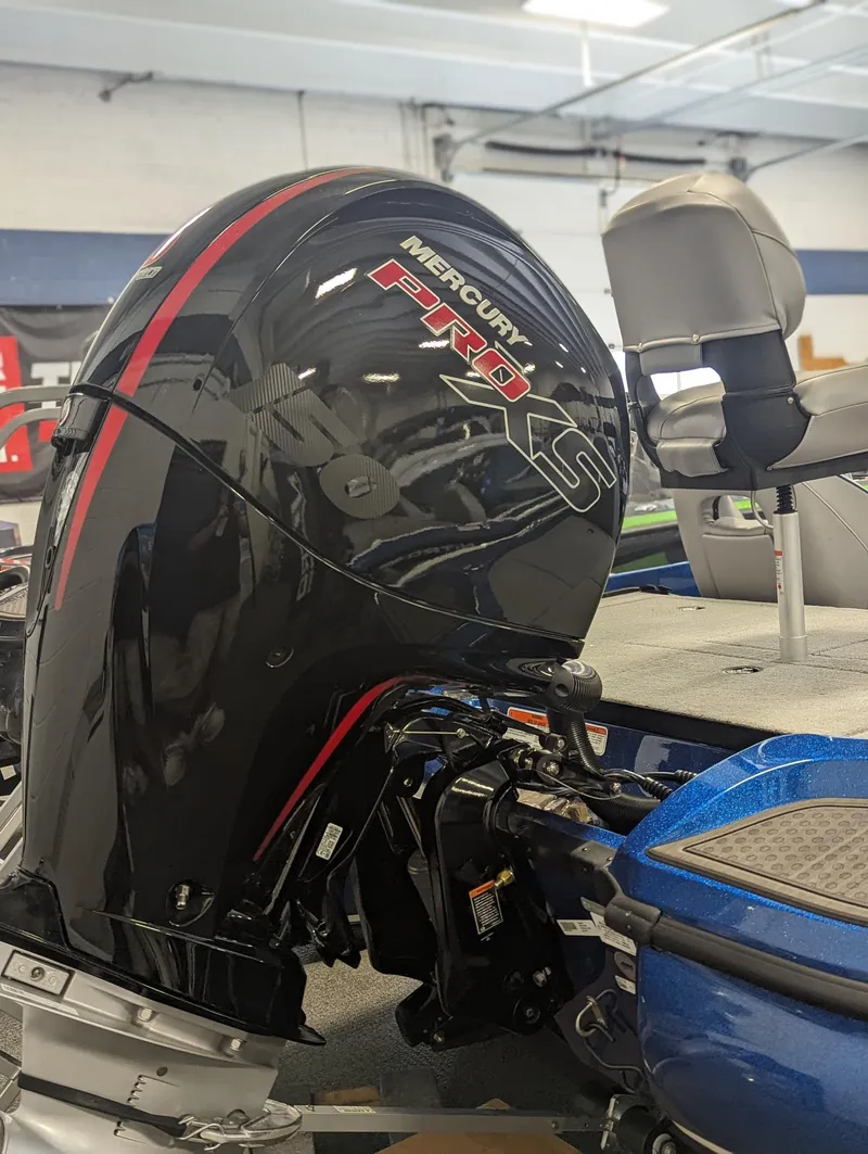 Slide: The Image of 2024 Nitro Z18Pro boat with Mercury Pro XS outboard motor in showroom. - 9