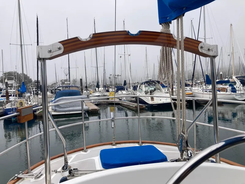 Slide: The Image of Sailboat Nantucket Island 33, 1984 model, docked in a marina with other boats. - 25