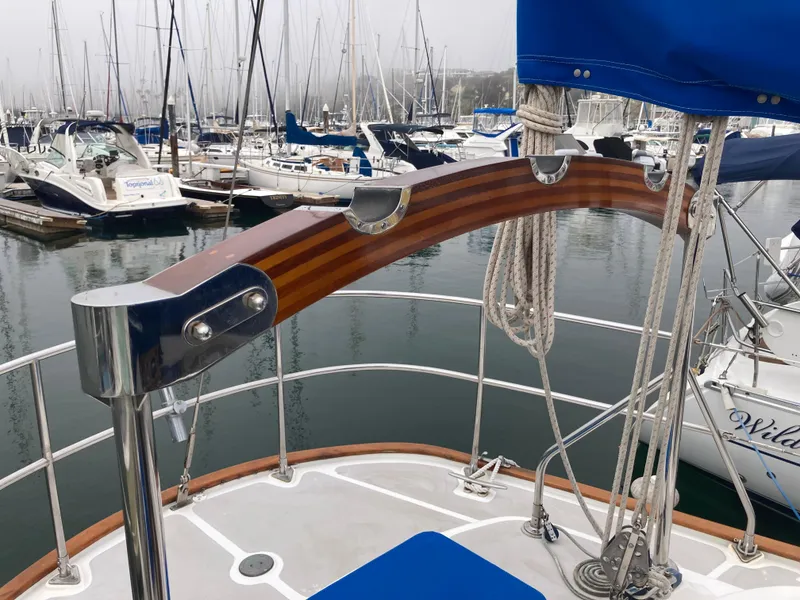 Slide: The Image of Sailboat deck view with wooden handrail, Nantucket Island 33, 1984, in marina. - 26