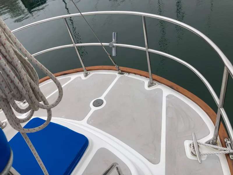 Slide: The Image of Bow of 1984 Nantucket Island 33 sailboat with railing and ropes. - 28