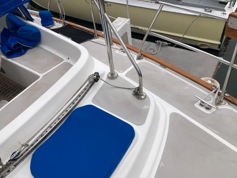 Slide: The Image of Cockpit of 1984 Nantucket Island 33 sailboat with blue cushions and stainless steel fittings. - 29