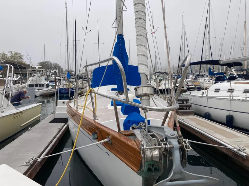 Slide: The Image of Sailboat docked in marina, Nantucket Island 33, 1984 model, with blue sail covers. - 4