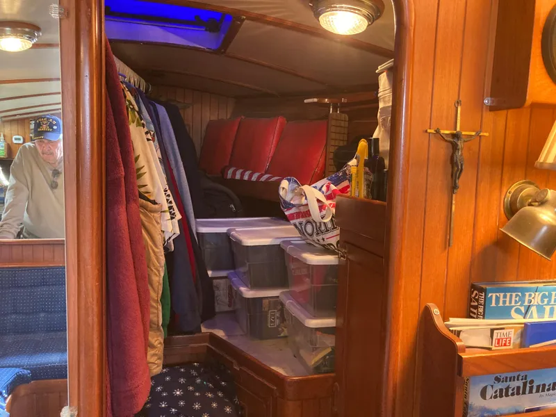 Slide: The Image of Cozy cabin interior of 1984 Nantucket Island 33 sailboat with storage and seating. - 50