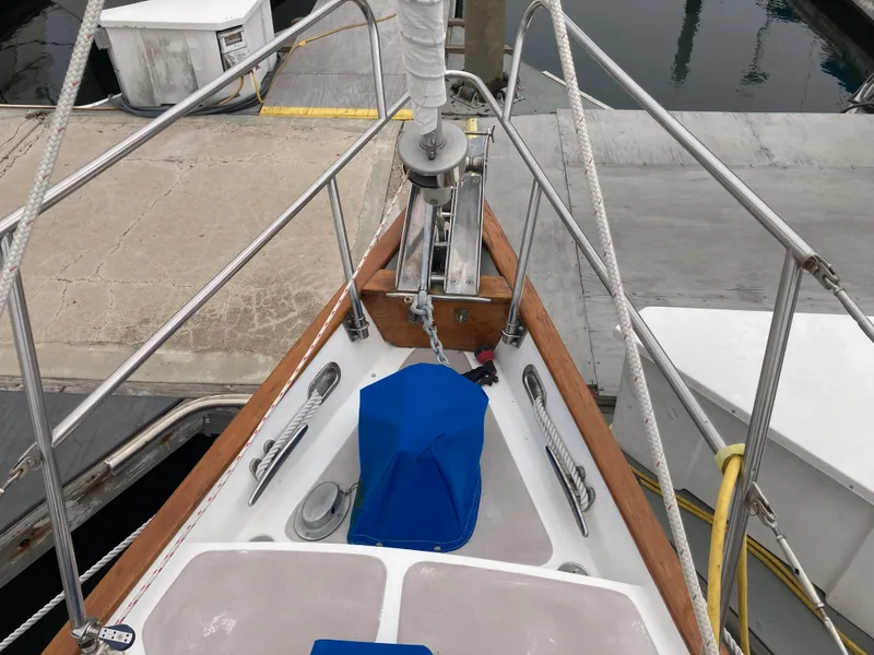 Slide: The Image of Bow of 1984 Nantucket Island 33 sailboat docked at marina. - 7