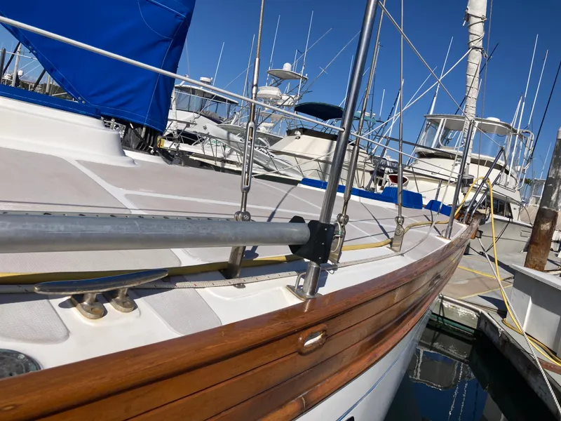 Slide: The Image of Sailboat Nantucket Island 33, 1984 model, docked at marina with blue cover. - 8