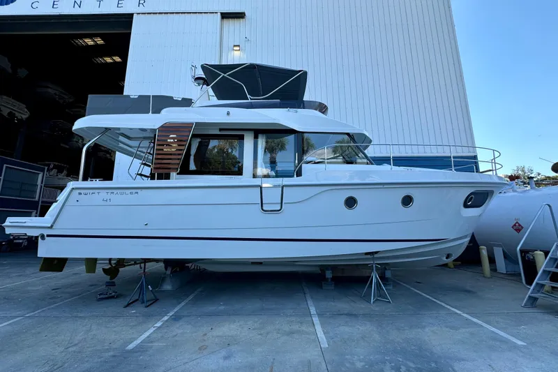 The Image of 2026 Beneteau Swift Trawler 41 Fly in a boatyard, side view. - 0