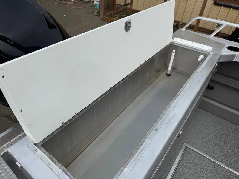 Slide: The Image of Open storage compartment on 2025 Thunder Jet 24 Alexis Pro boat. - 11