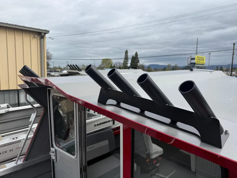 Slide: The Image of 2025 Thunder Jet 24 Alexis Pro boat with rod holders on the roof. - 17