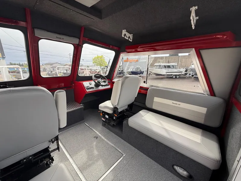Slide: The Image of Interior of 2025 Thunder Jet 24 Alexis Pro boat with modern seating and dashboard. - 20
