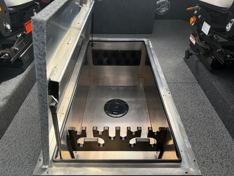 Slide: The Image of Open storage compartment in 2025 Thunder Jet 24 Alexis Pro boat interior. - 21